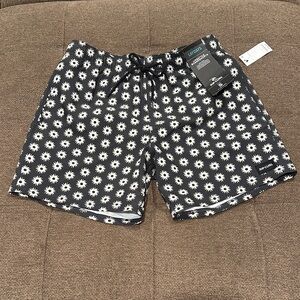 Rip Curl Black Board Shorts with White Sunburst Design